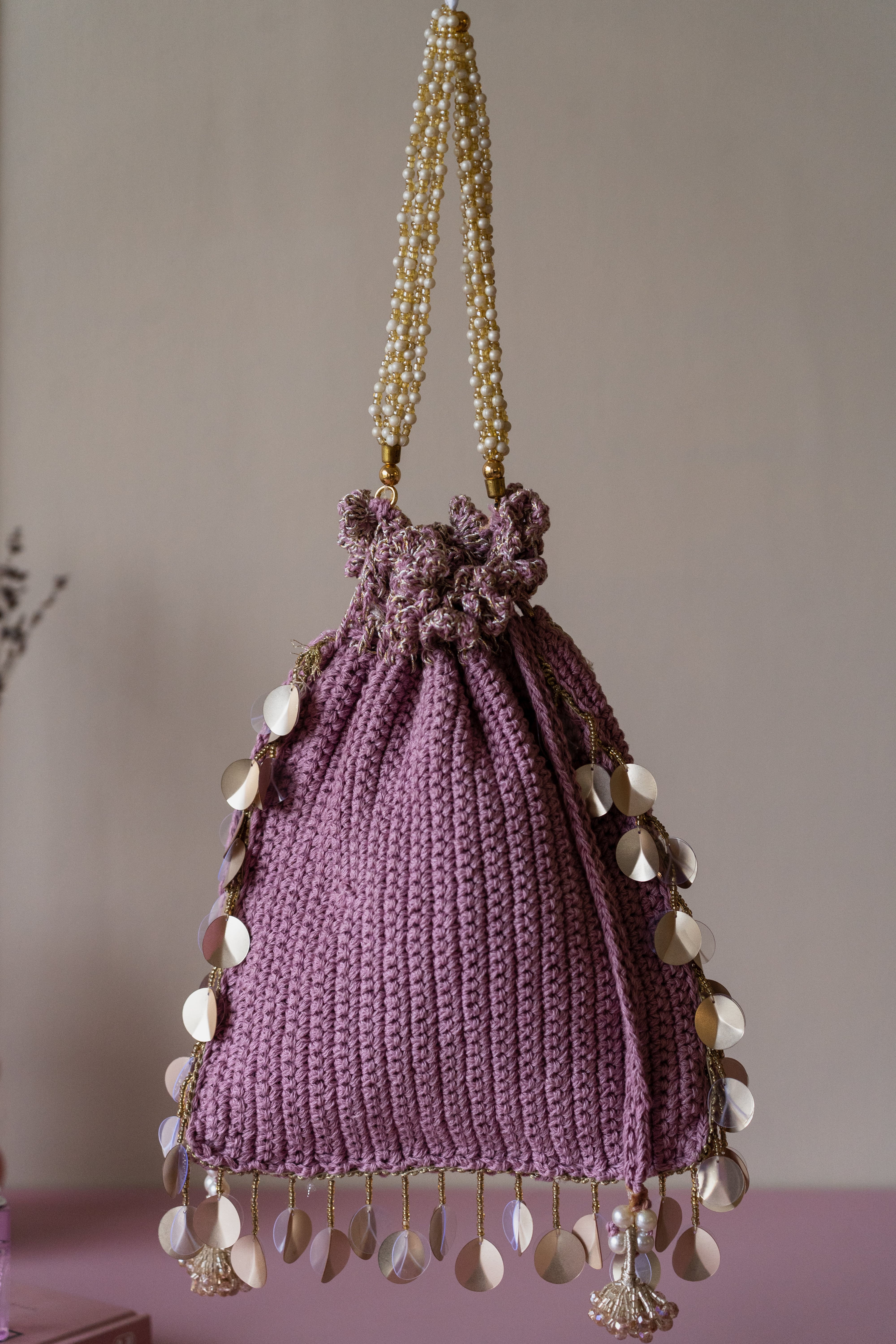 Mauve pearl flat potli bag