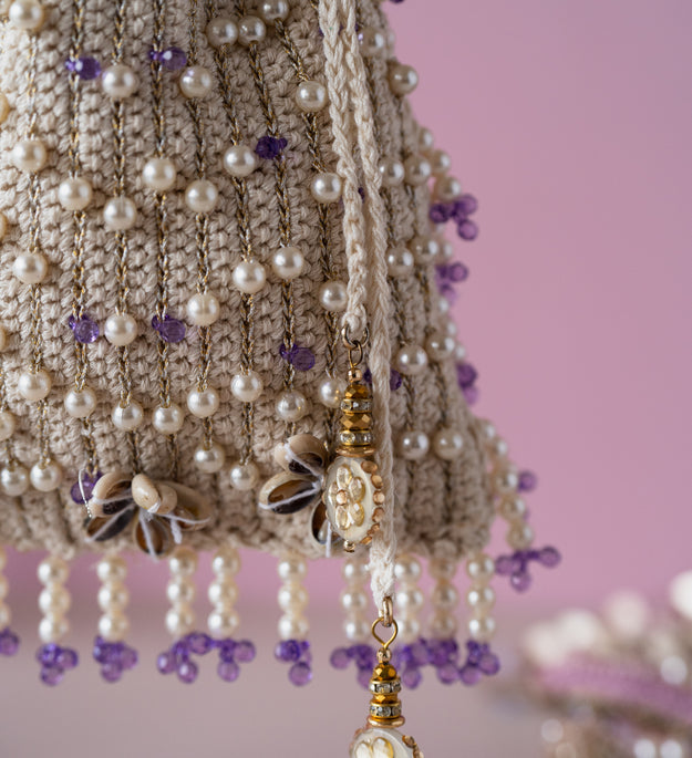 Ivory purple flat potli bag