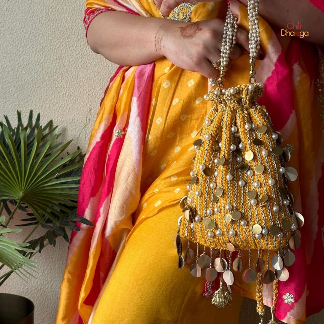 Yellow pearl flat crochet potli bag